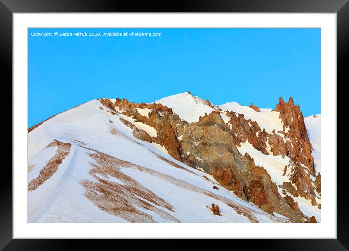 Strict and majestic peaks of Mount Erciyes on a clear sunny day in central Turkey. Framed Mounted Print by Sergii Petruk