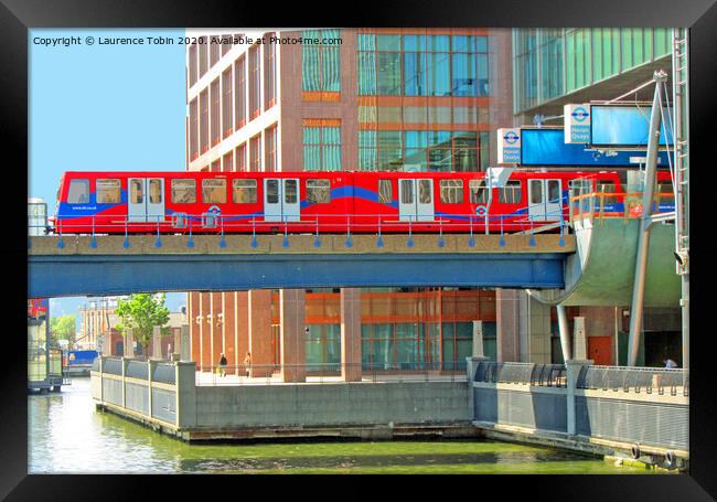 Docklands Light Railway train at Heron Quay Framed Print by Laurence Tobin
