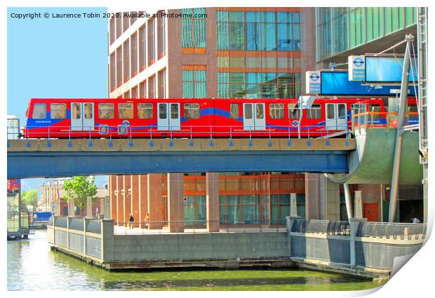 Docklands Light Railway train at Heron Quay Print by Laurence Tobin