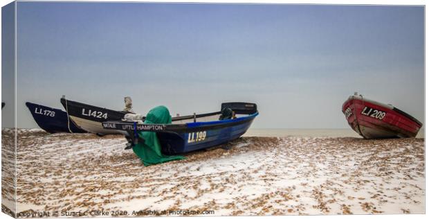 Fishing boats in the snow Canvas Print by Stuart C Clarke