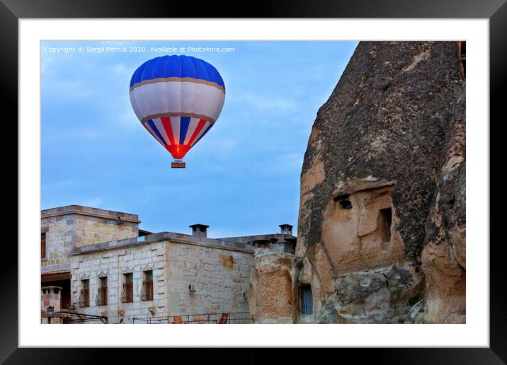 Balloon flying over the old town of Cappadocia Framed Mounted Print by Sergii Petruk