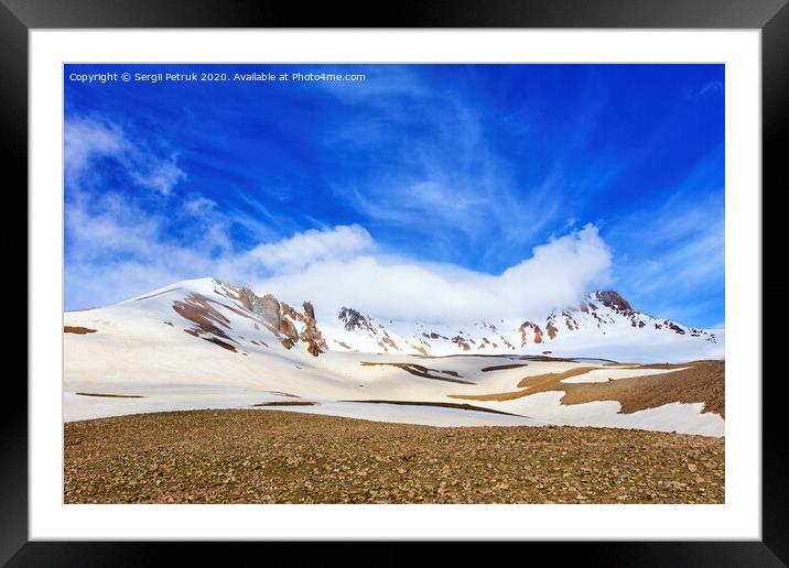 View of Mount Erciyas in central Turkey against a blue bright sky and white fog. Framed Mounted Print by Sergii Petruk