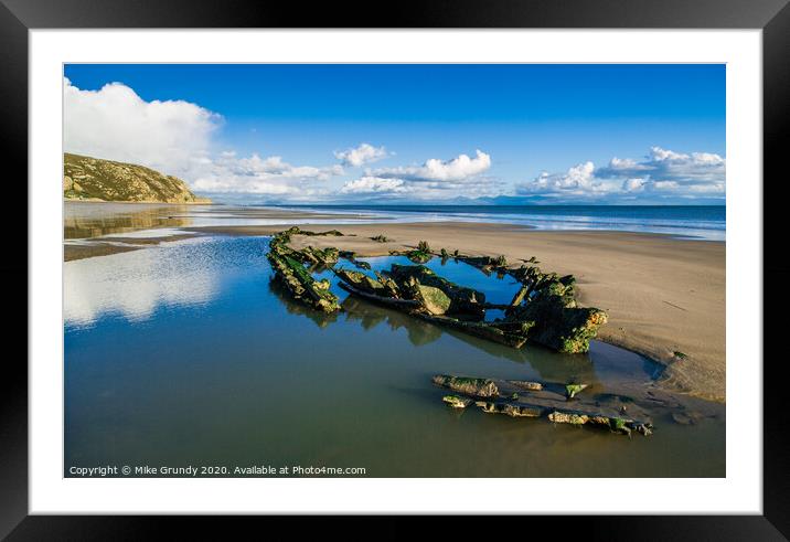 Low tide wreck Framed Mounted Print by Mike Grundy
