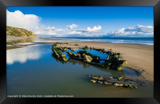 Low tide wreck Framed Print by Mike Grundy