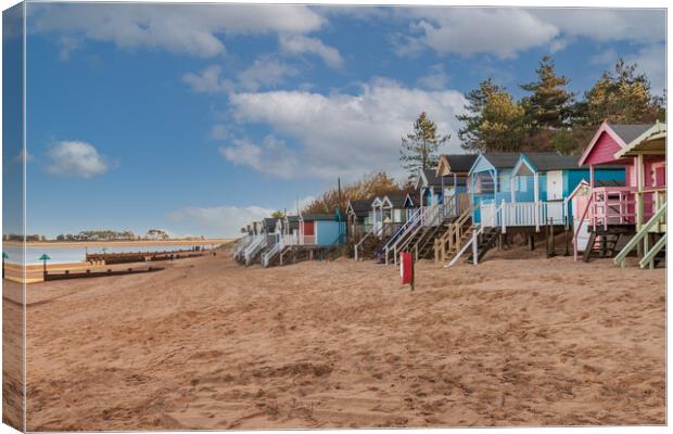 Vivid Beach Huts at WellsnexttheSea Canvas Print by Kevin Snelling