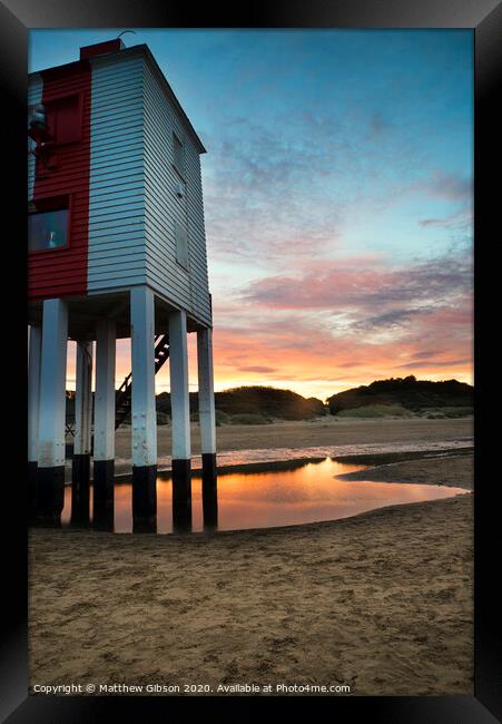 Beautiful landscape sunrise stilt lighthouse on beach Framed Print by Matthew Gibson