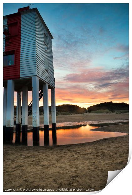Beautiful landscape sunrise stilt lighthouse on beach Print by Matthew Gibson