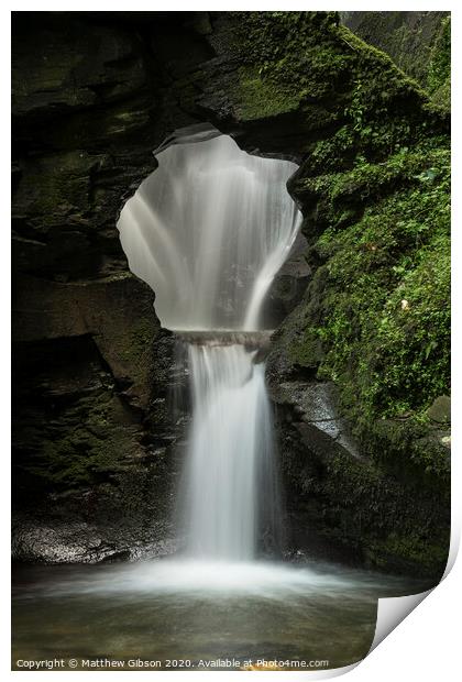Beautiful flowing waterfall with magical fairytale feel in lush green forest location Print by Matthew Gibson