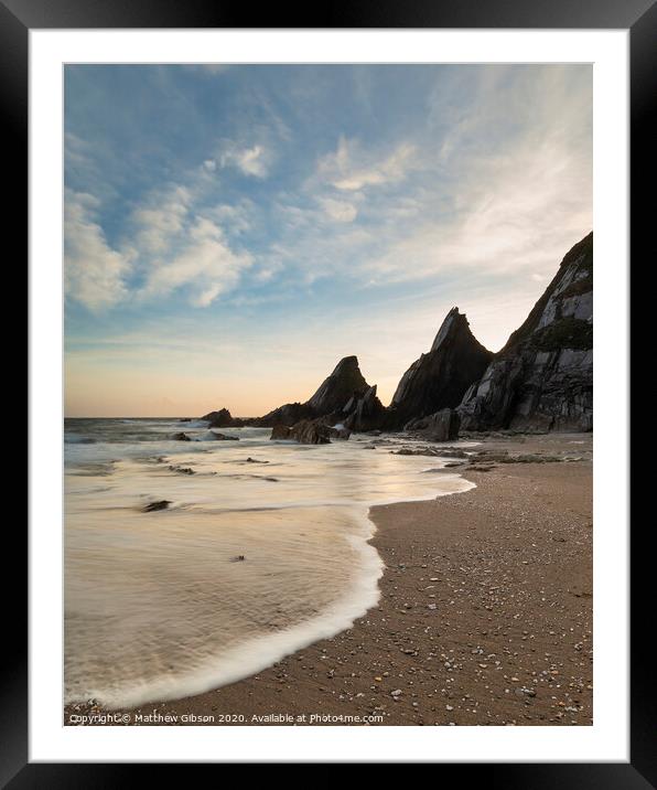 Stunning sunset landscape image of Westcombe Beach in Devon England with jagged rocks on beach and stunning cloud formations Framed Mounted Print by Matthew Gibson