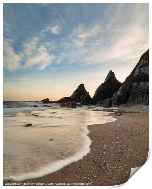Stunning sunset landscape image of Westcombe Beach in Devon England with jagged rocks on beach and stunning cloud formations Print by Matthew Gibson