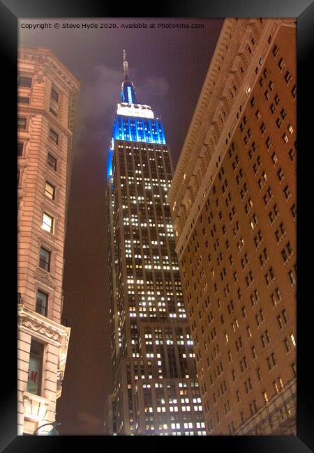 The Empire State Building, New York City illuminated at night Framed Print by Steve Hyde