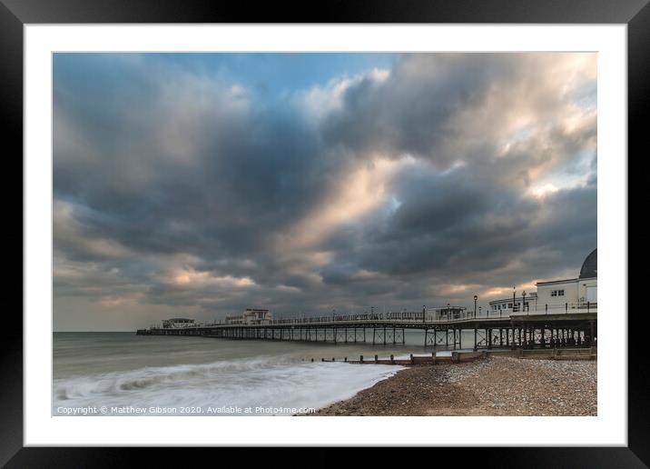 Beautiful long exposure sunset landscape image of pier at sea in Worthing England Framed Mounted Print by Matthew Gibson