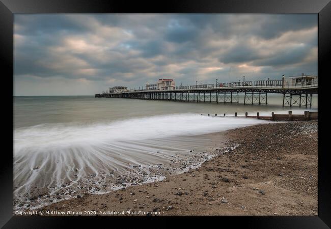 Beautiful long exposure sunset landscape image of pier at sea in Worthing England Framed Print by Matthew Gibson