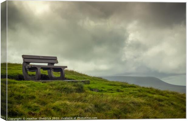Bench overlooking Pendle Hill in Lancashire Canvas Print by Heather Sheldrick
