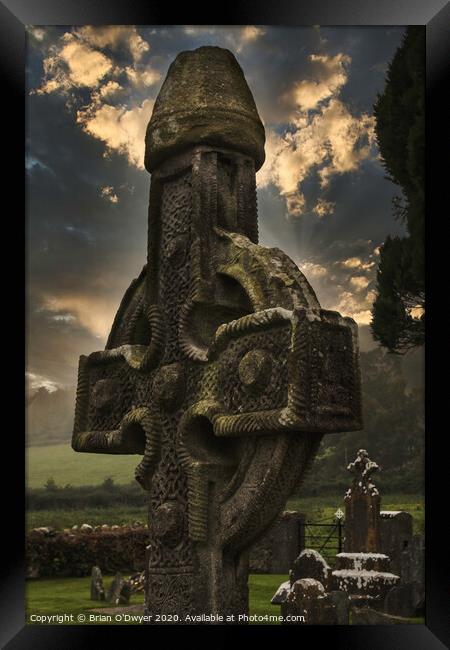 Celtic cross sunlight Framed Print by Brian O'Dwyer