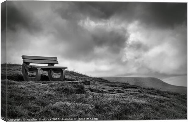 Weets Hill Bench with Pendle Hill in Background Canvas Print by Heather Sheldrick