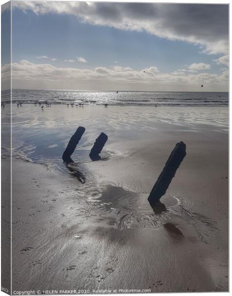 Old pipe supports on Jersey Marine Beach Canvas Print by HELEN PARKER