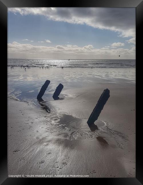 Old pipe supports on Jersey Marine Beach Framed Print by HELEN PARKER