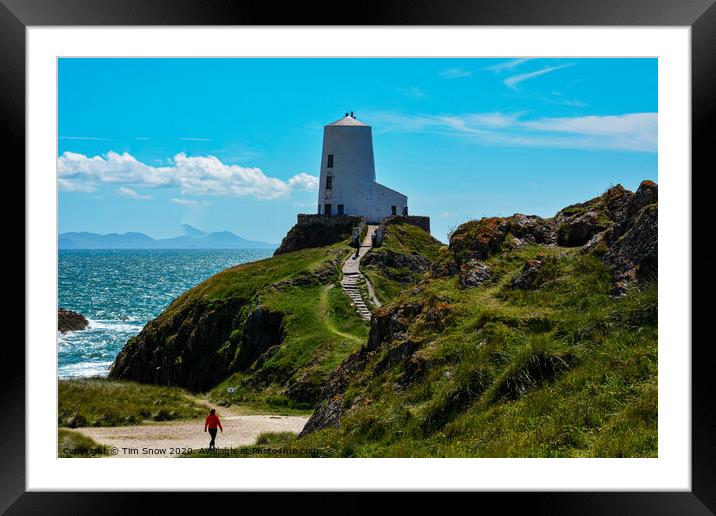 Walking towards Twr Mawr lighthouse on Llanddwyn Island Framed Mounted Print by Tim Snow