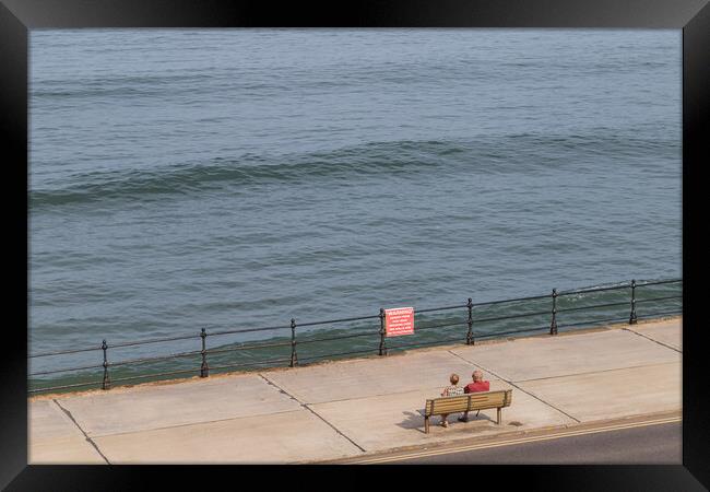 Looking down on a couple on the Scarborough promenade Framed Print by Jason Wells