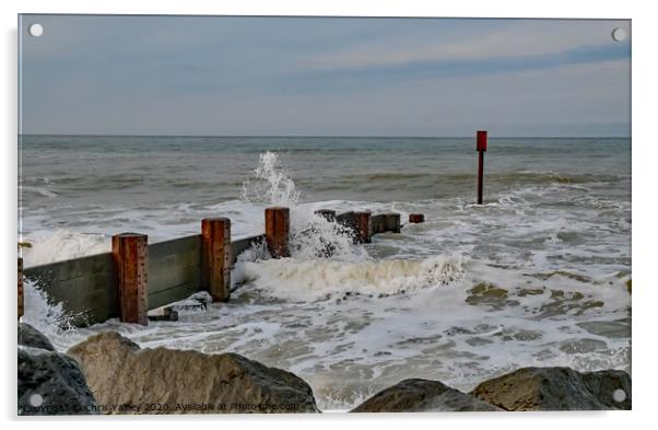 Waves crashing over the wooden groynes at high tide on Cart Gap beach Acrylic by Chris Yaxley