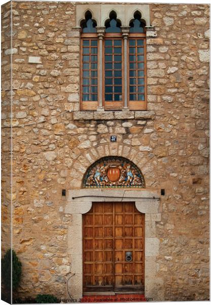 Mediterranean Romanesque building doorway Canvas Print by Miguel Herrera