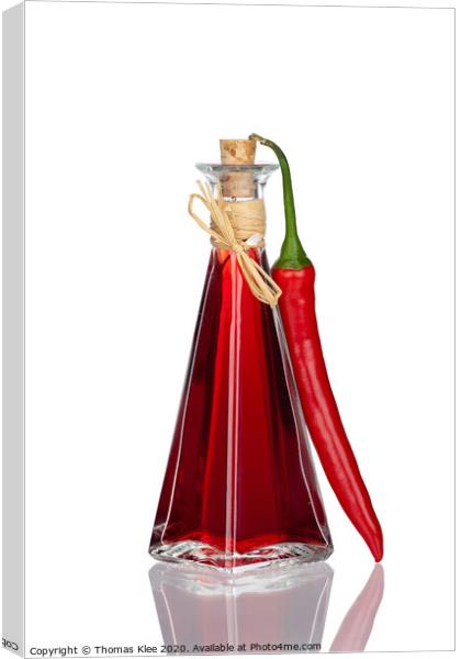 Bottle Chili Oil and Chili Pepper with real reflection Canvas Print by Thomas Klee