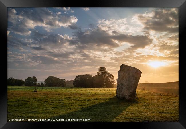 Stunning Summer sunrise landscape of Neolithic standing stones in English cluntryside with gorgeous light with slight background mist Framed Print by Matthew Gibson