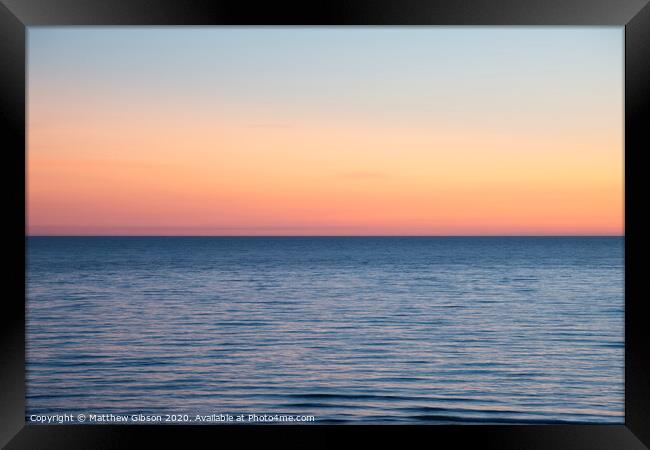 Beautiful Summer landscape sunset image of colorful vibrant sky over calm long exposure sea Framed Print by Matthew Gibson