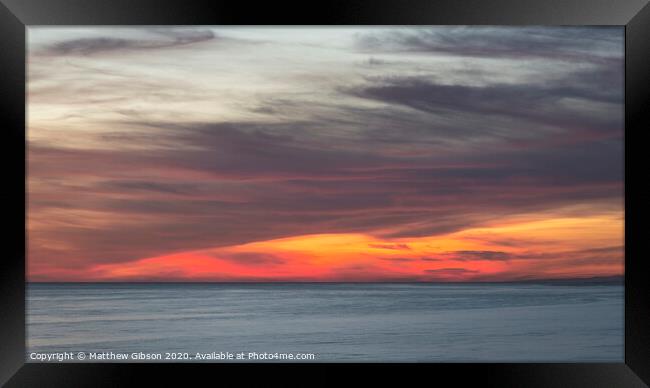 Beautiful Summer landscape sunset image of colorful vibrant sky over calm long exposure sea Framed Print by Matthew Gibson