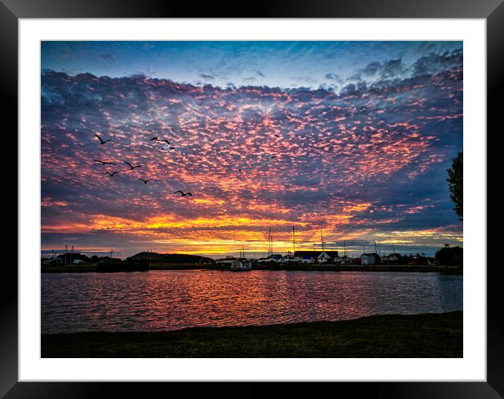 Sunset over water Framed Mounted Print by David Buckland