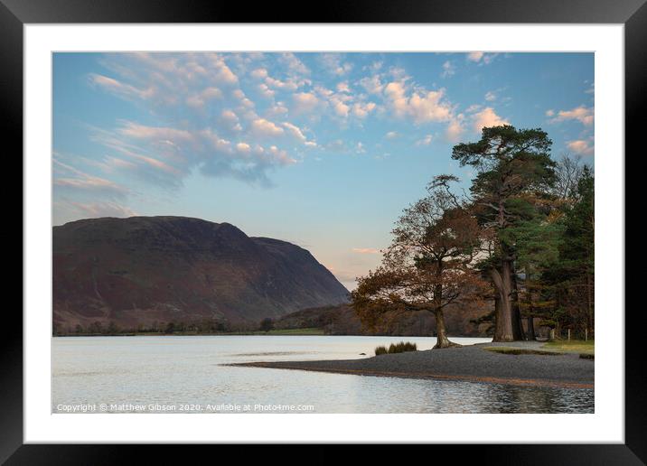 Majestic vibrant Autumn Fall landscape Buttermere in Lake District with beautiful early morning sunlight playing across the hills and mountains Framed Mounted Print by Matthew Gibson