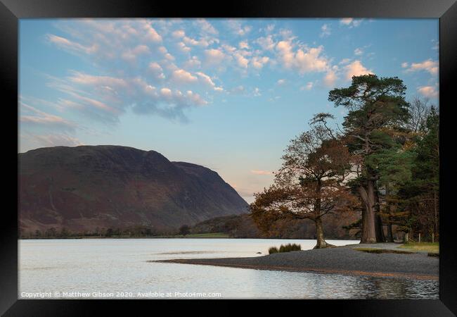 Majestic vibrant Autumn Fall landscape Buttermere in Lake District with beautiful early morning sunlight playing across the hills and mountains Framed Print by Matthew Gibson