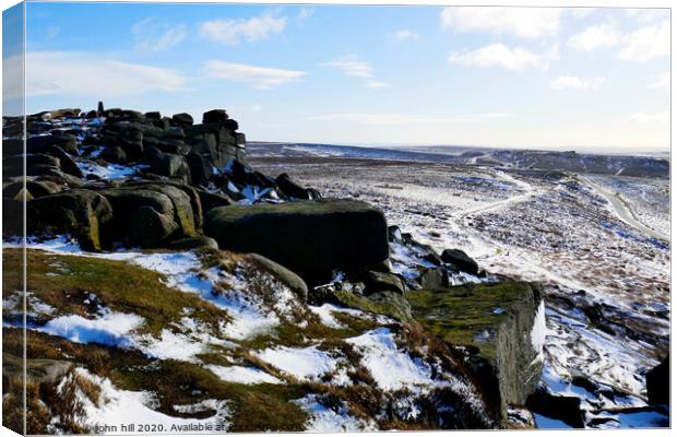 Stanage edge in Winter at Derbyshire. Canvas Print by john hill