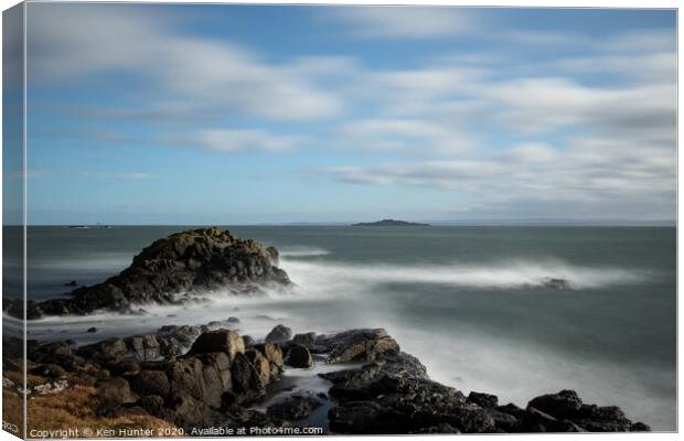 Calmed Whitewater Around Craggy Foreshore Canvas Print by Ken Hunter