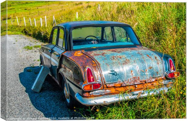 An old vintage car rusting in a Shetland farm Canvas Print by Richard Ashbee