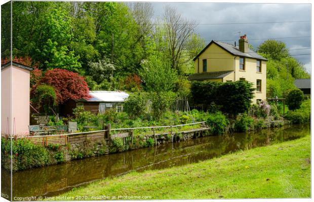 Home along the Canal Canvas Print by Jane Metters