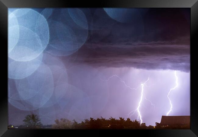 Bokeh Lightning. Texas. Framed Print by John Finney