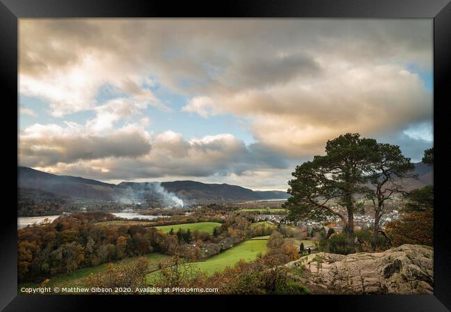 Majestic Autumn Fall landscape image of view from Castlehead in Lake District over Derwentwater towards Catbells and Grisedale Pike at sunset with epic lighting in sky Framed Print by Matthew Gibson