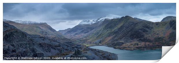 Beautiful landscape image of Dinorwig Slate Mine and snowcapped Snowdon mountain in background during Winter in Snowdonia with Llyn Peris in foreground Print by Matthew Gibson
