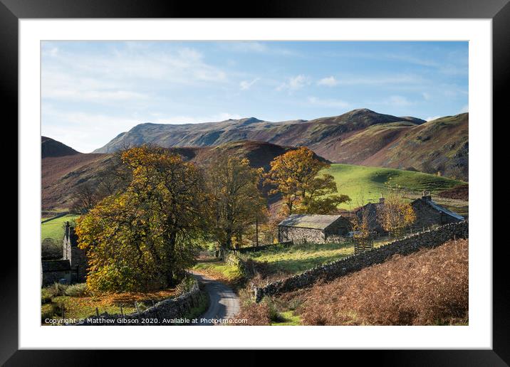 Old derelict farm buildings in Autumn Fall landscape image in Lake District with Sleet Fell in background with epic light on the fells Framed Mounted Print by Matthew Gibson