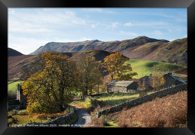Old derelict farm buildings in Autumn Fall landscape image in Lake District with Sleet Fell in background with epic light on the fells Framed Print by Matthew Gibson