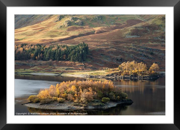 Stunning Autumn Fall landscape of Hawes Water with epic lighting and dramatic sunlight in Lake District Framed Mounted Print by Matthew Gibson