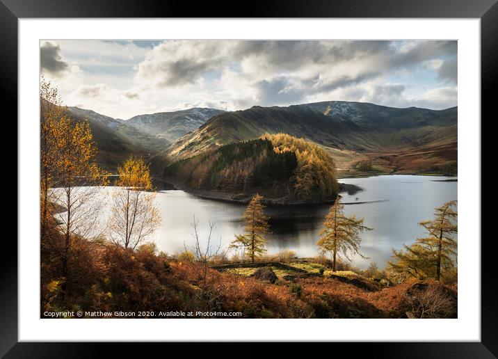 Stunning Autumn Fall landscape of Hawes Water with epic lighting and dramatic sunlight in Lake District Framed Mounted Print by Matthew Gibson