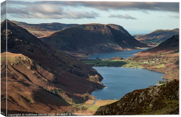 Majestic vibrant Autumn Fall landscape of Buttermere and Crummock Water flanked by mountain peaks of Haystacks High Stile and Mellbreak in Lake District Canvas Print by Matthew Gibson
