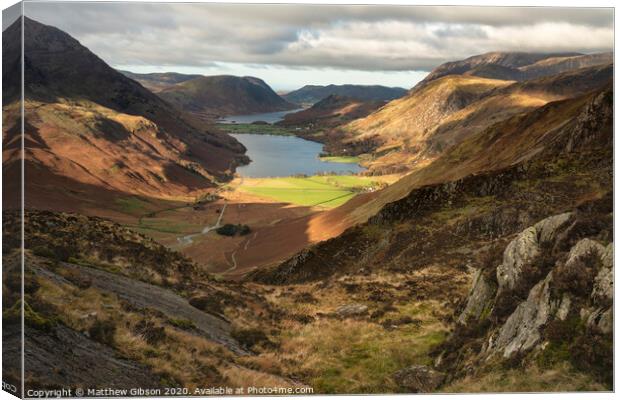 Majestic vibrant Autumn Fall landscape of Buttermere and Crummock Water flanked by mountain peaks of Haystacks High Stile and Mellbreak in Lake District Canvas Print by Matthew Gibson