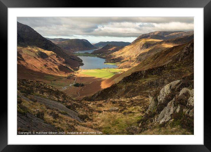 Majestic vibrant Autumn Fall landscape of Buttermere and Crummock Water flanked by mountain peaks of Haystacks High Stile and Mellbreak in Lake District Framed Mounted Print by Matthew Gibson