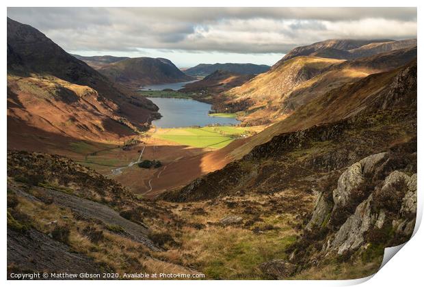 Majestic vibrant Autumn Fall landscape of Buttermere and Crummock Water flanked by mountain peaks of Haystacks High Stile and Mellbreak in Lake District Print by Matthew Gibson