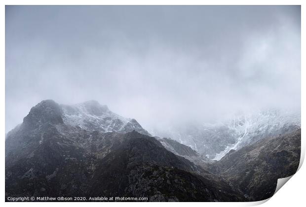 Stunning moody dramatic Winter landscape image of snowcapped Y Garn mountain in Snowdonia Print by Matthew Gibson