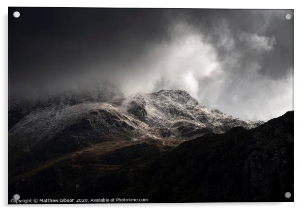 Stunning moody dramatic Winter landscape image of snowcapped Tryfan mountain in Snowdonia with stormy weather brooding overhead Acrylic by Matthew Gibson